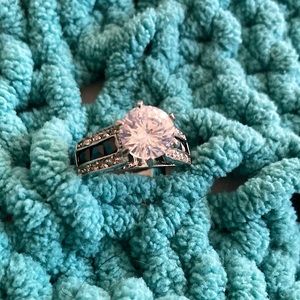 Pretty costume quality faux diamond ring with onyx inset. Estimated at size 9/10